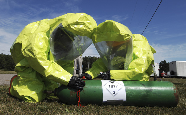 Lyle Black and Darwyn Rankins, firefighters from the Selfridge Fire Department in Selfridge, Michigan, seal a simulated detonated chlorine tank Aug. 27, 2008, during an Installation Protection Program Full-Scale Exercise involving the U.S. Air Force 127th Wing and Tenants at Selfridge Air National Guard Base. During the full-day exercise, personnel were evaluated on their ability to respond to threats from weapons of mass destruction and from  chemical, biological, radiological and nuclear attacks. (U.S. Air Force photo by Senior Airman Jeremy L. Brownfield/Released)