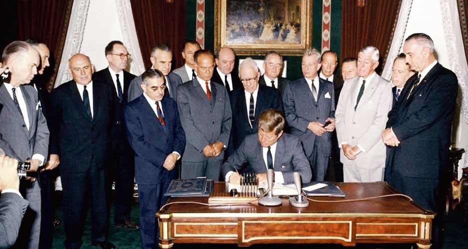 President John F. Kennedy Signing Partial Test Ban Treaty in 1963.