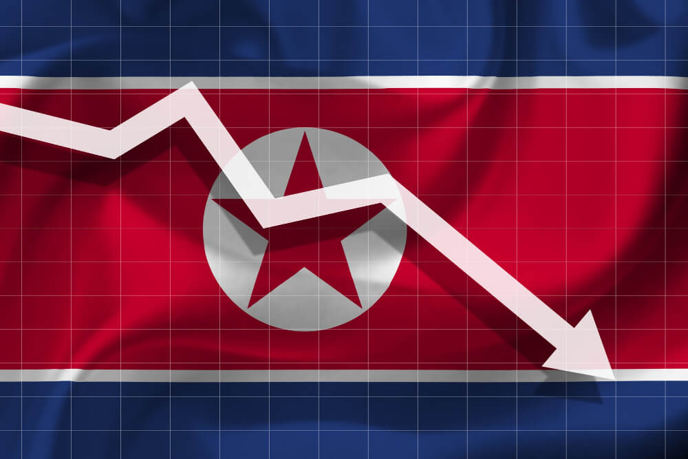 White arrow falls against background flag North Korea.